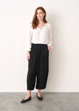 Cropped satin black trousers