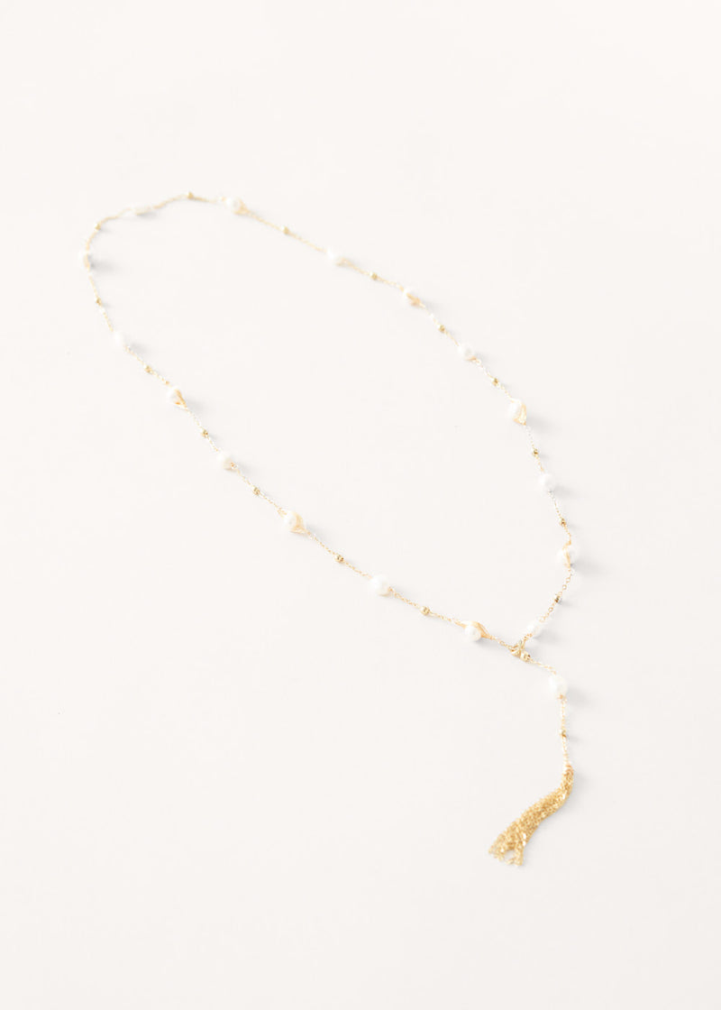 Pearl on gold chain necklace with tassel detail