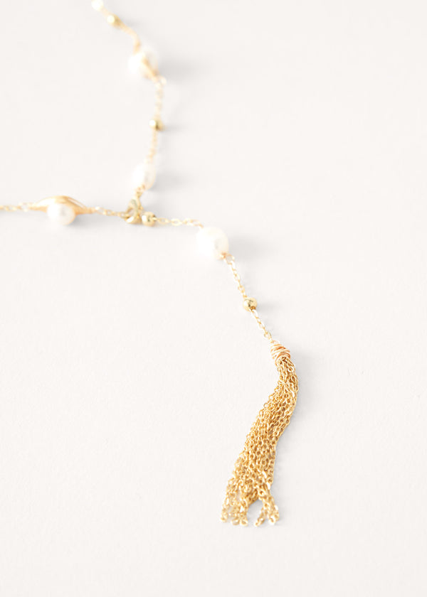 Pearl on gold chain necklace with tassel detail