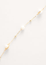 Pearl on gold chain necklace with tassel detail