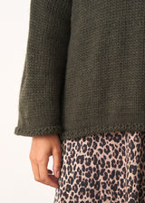 Dark green roll neck jumper