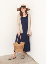 Dark blue satin sleeveless dress, floppy hat and oatmeal cardigan