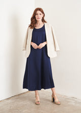 Dark blue satin sleeveless dress and light oatmeal jacket