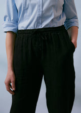 Black tapered linen trousers