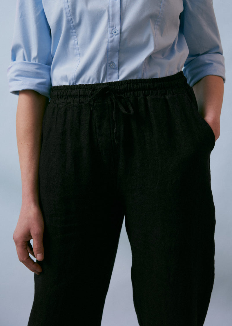 Black tapered linen trousers