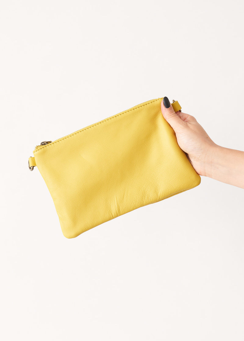 Acid yellow leather clutch bag