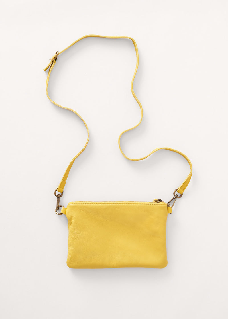 Acid yellow leather clutch bag