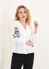 White top with black embroidery