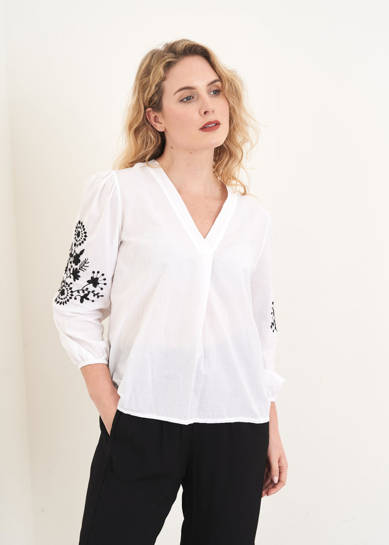 White top with black embroidery