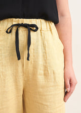 Pale yellow linen drawstring trousers