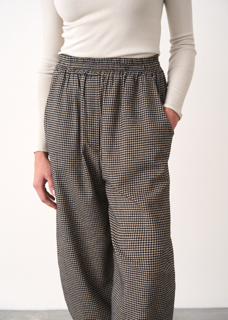 Black and white check barrel leg trousers