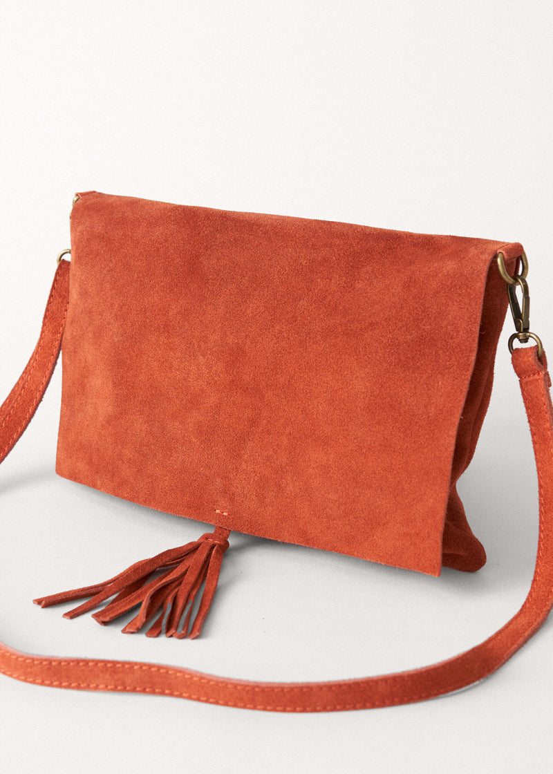 Suede rust flap bag with tassel