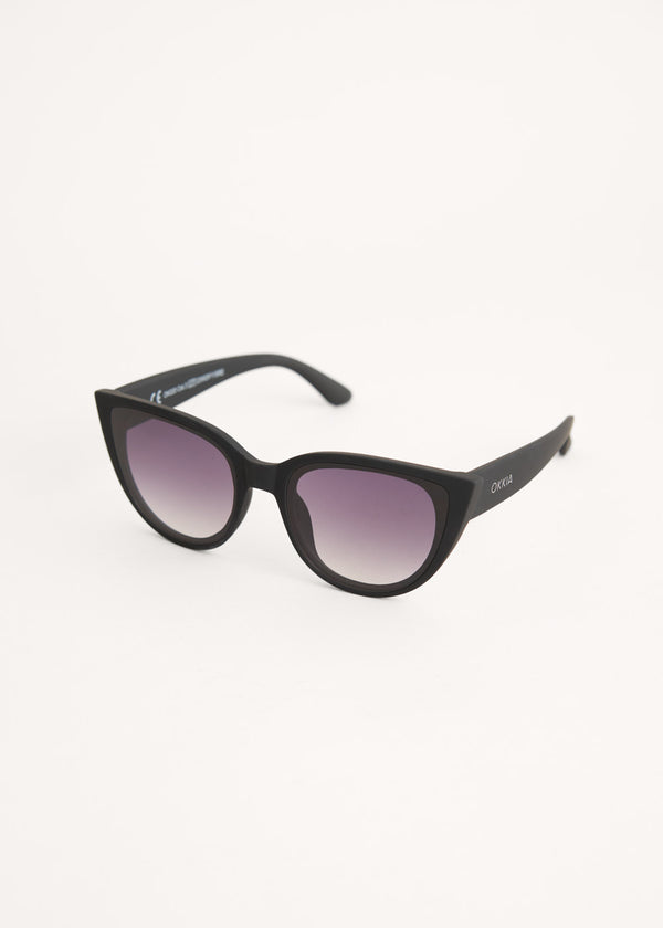 A pair of oversized cat eye sunglasses with black frames and blue lenses