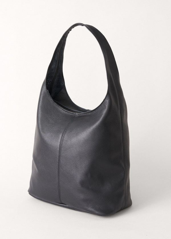 Large black leather bag with round strap