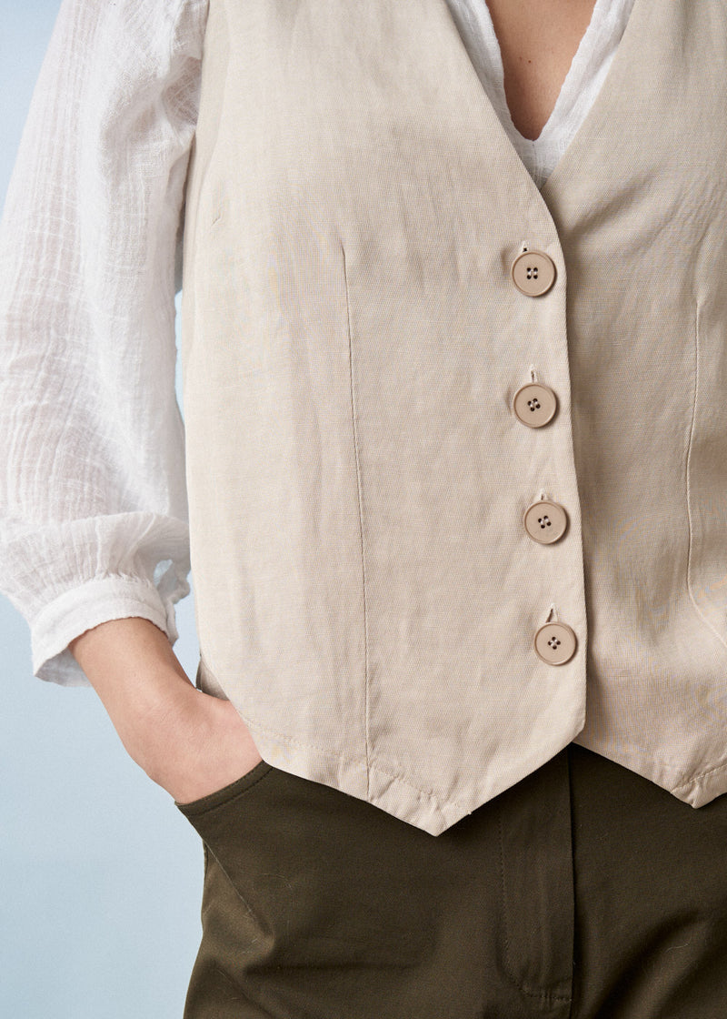 Light oatmeal waistcoat with buttons